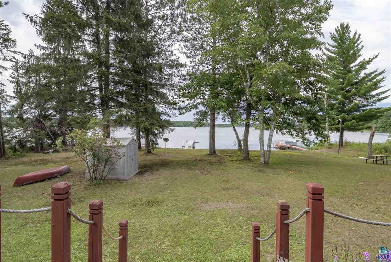 6190 East Lyman Lake Road South Range, WI 54874 - Photo 4 of 25 Shed, tree coverage, and land to lake from home