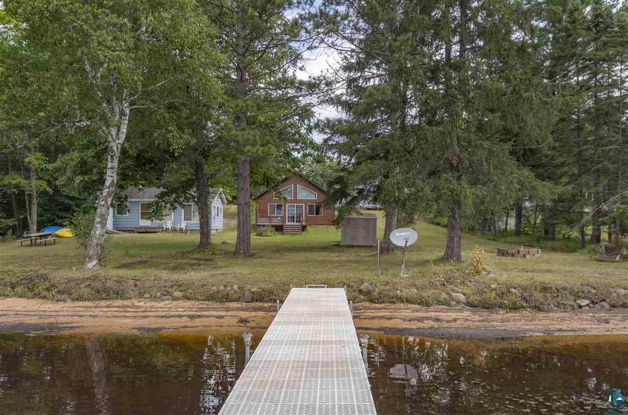 6190 East Lyman Lake Road South Range, WI 54874 - Photo 7 of 25 The view of the cabin from the dock on the lake.
