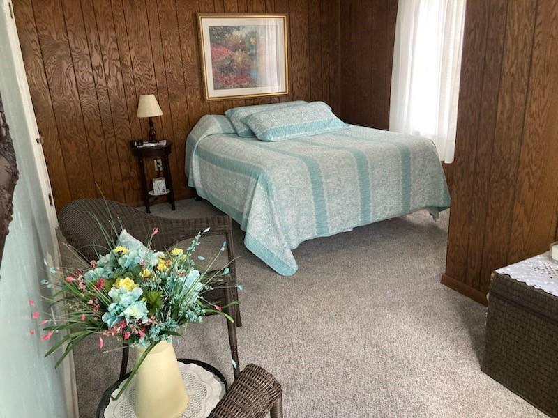 26 Paxton Road Sandy Lake, PA 16145 - Photo 13 of 23 a bedroom with bed and a couch