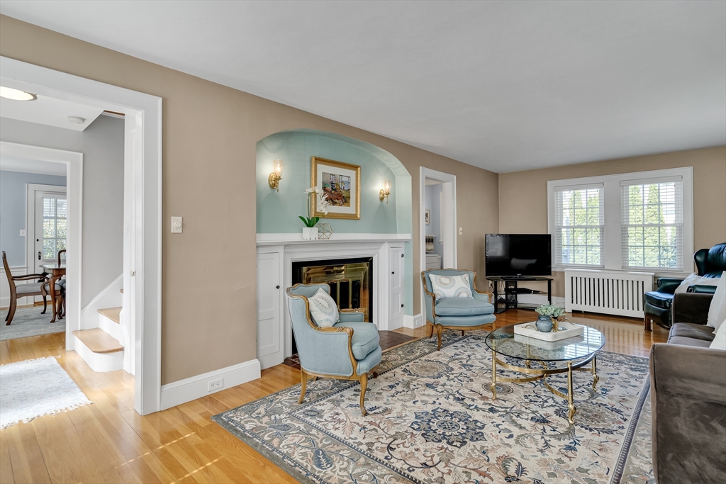90 Governors Road Milton, MA 02186 - Photo 11 of 28 a living room with furniture and a fireplace