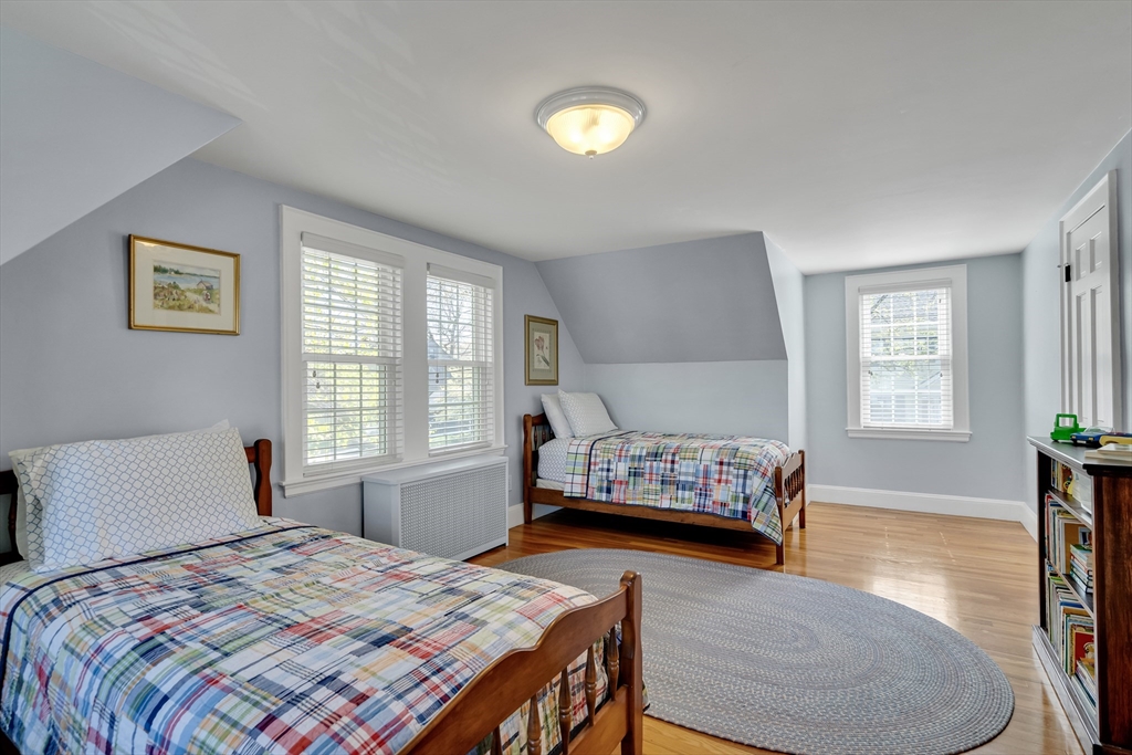 90 Governors Road Milton, MA 02186 - Photo 16 of 28 a bedroom with a bed and wooden floor
