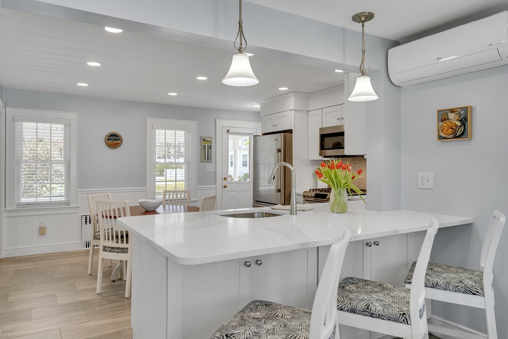 90 Governors Road Milton, MA 02186 - Photo 7 of 28 a kitchen with a sink a counter top space and stainless steel appliances
