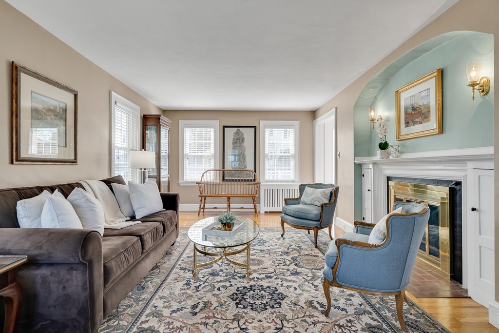 90 Governors Road Milton, MA 02186 - Photo 10 of 28 a living room with furniture and a fireplace