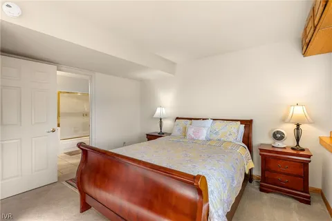 a bedroom with a bed and a lamp