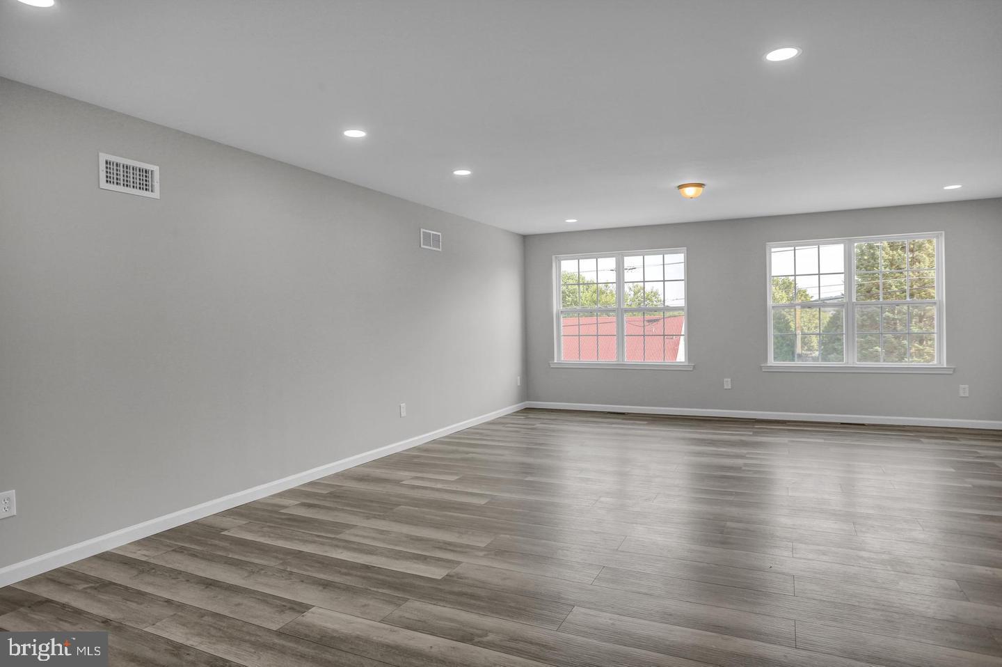 46 Rosalie's Way Temple, PA 19560 - Photo 12 of 12 an empty room with wooden floor and windows