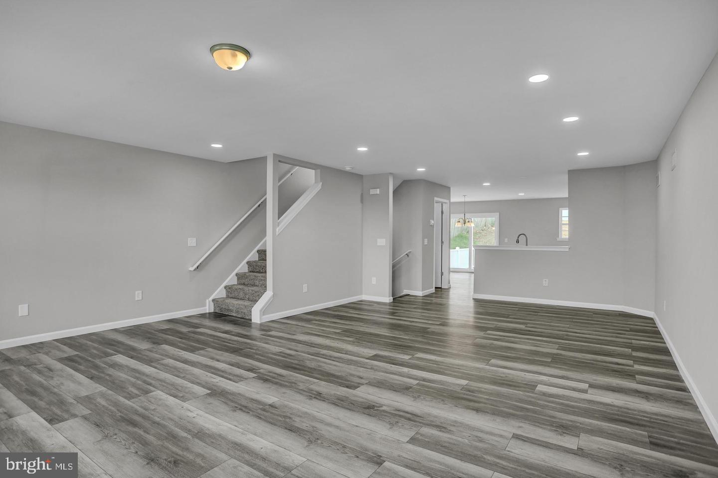 46 Rosalie's Way Temple, PA 19560 - Photo 2 of 12 a view of an empty room with wooden floor