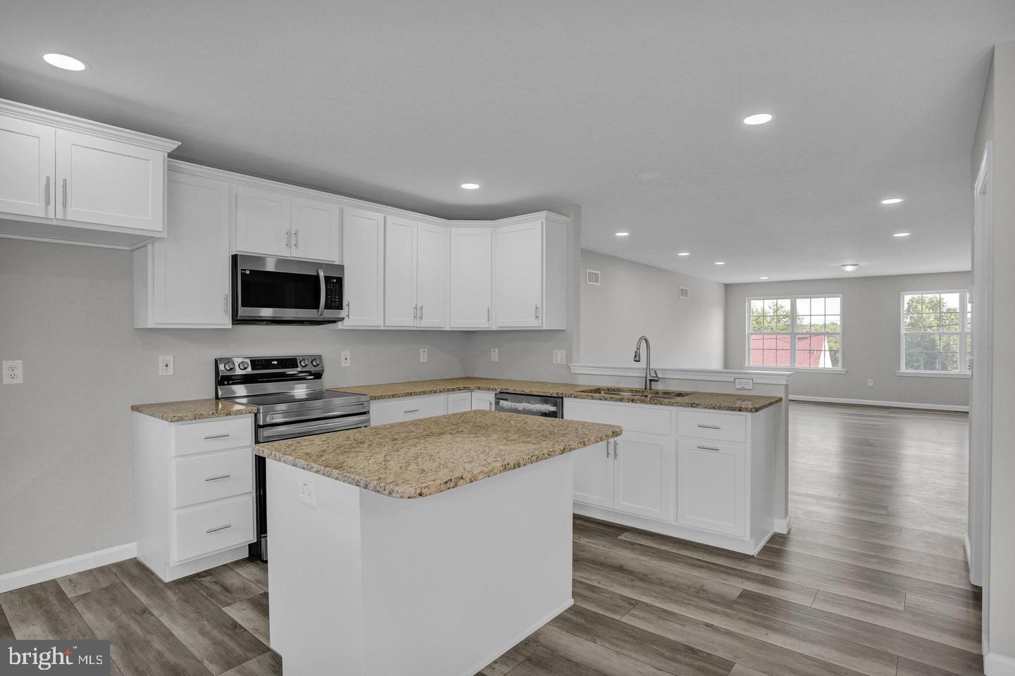 46 Rosalie's Way Temple, PA 19560 - Photo 6 of 12 a kitchen with a sink stove and microwave