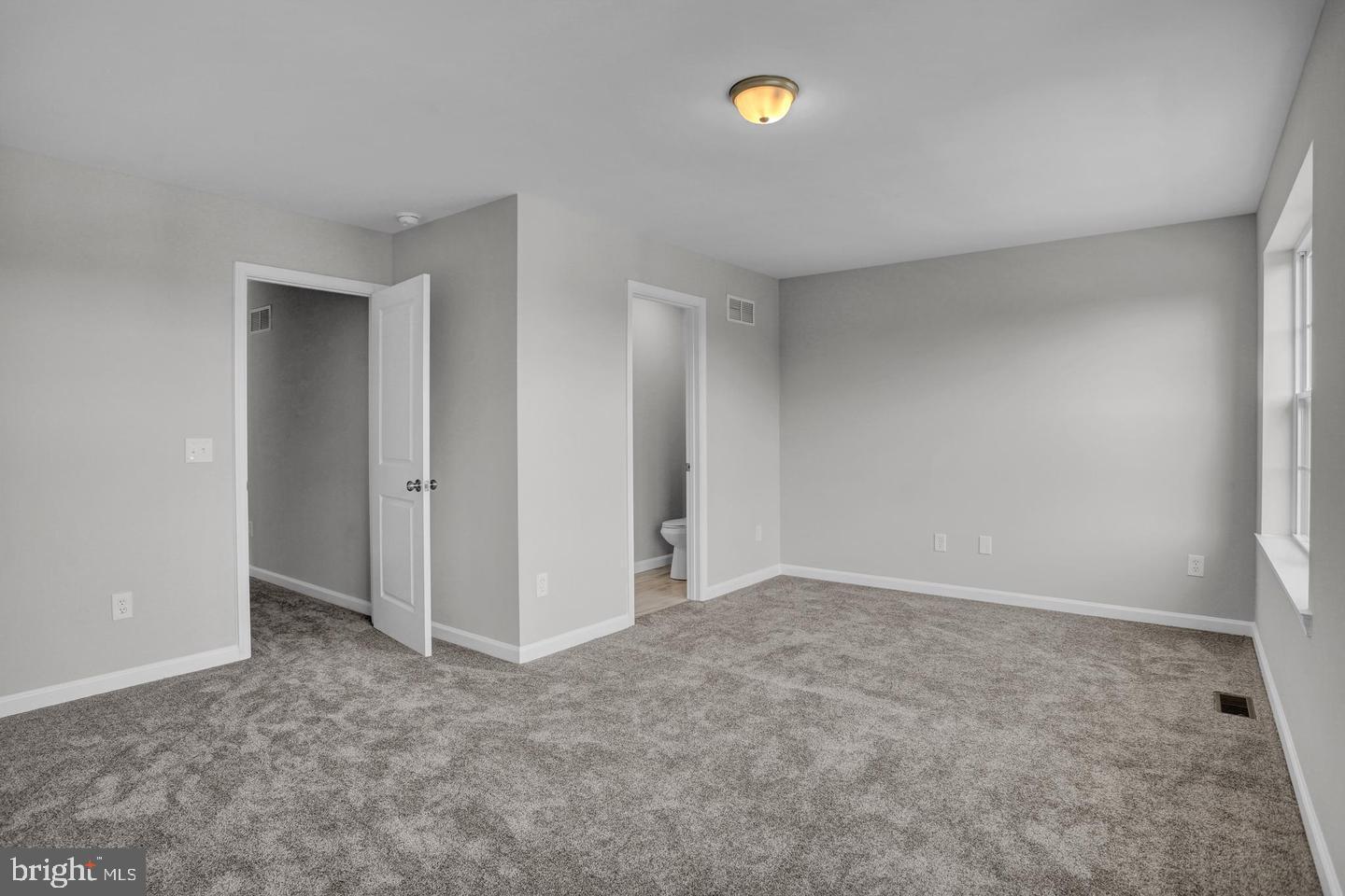 46 Rosalie's Way Temple, PA 19560 - Photo 10 of 12 an empty room with closet and a window