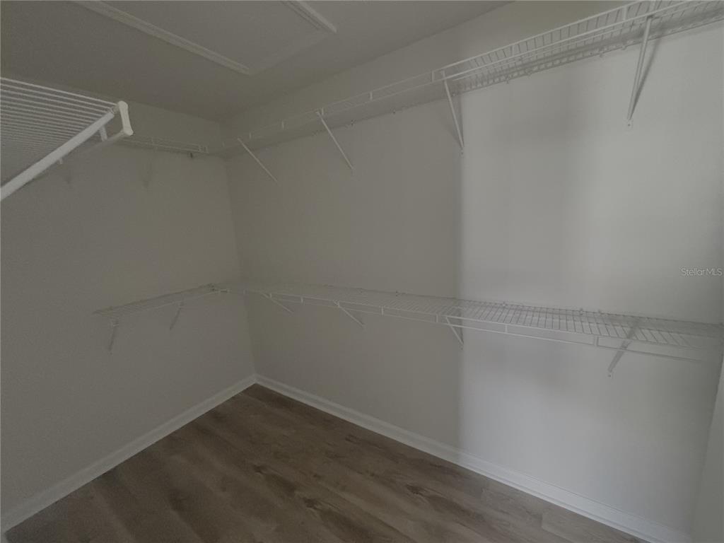 4194 Southwest 47th Court Ocala, FL 34474 - Photo 11 of 29 a empty closet with wooden floor