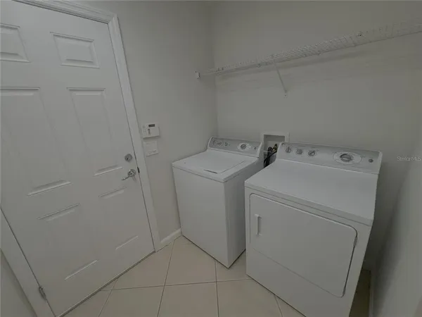 a utility room with dryer and washer