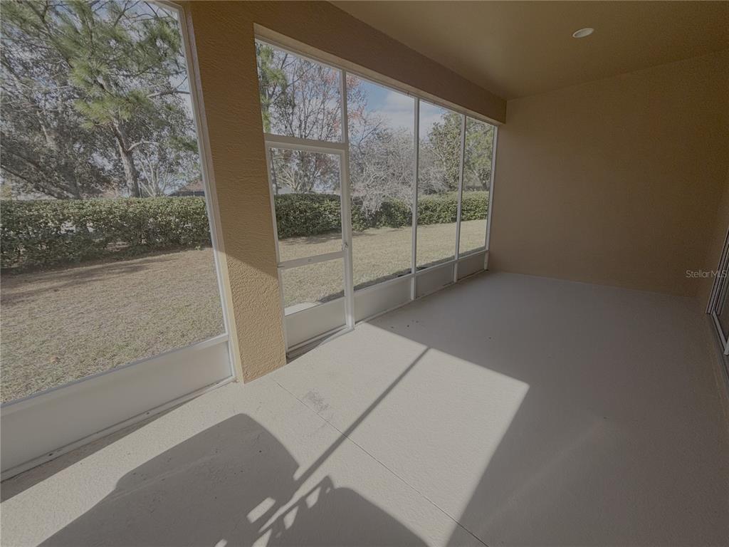 4194 Southwest 47th Court Ocala, FL 34474 - Photo 27 of 29 a view of a room with wooden floor and windows
