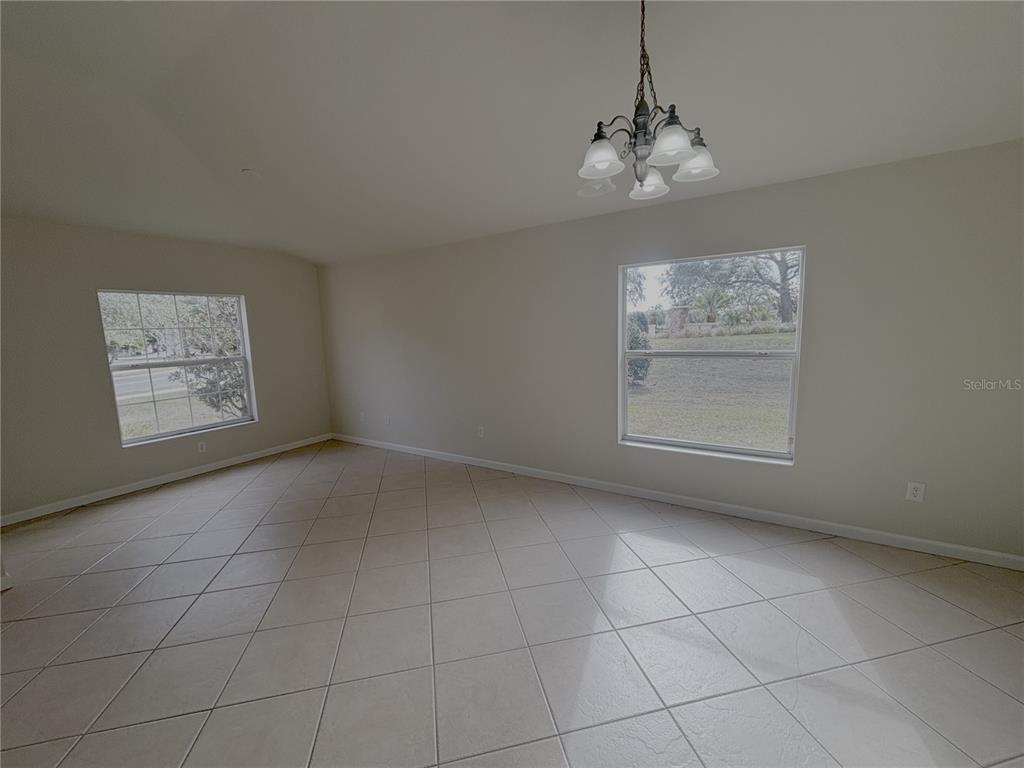 4194 Southwest 47th Court Ocala, FL 34474 - Photo 3 of 29 a view of a room with an empty space and a window