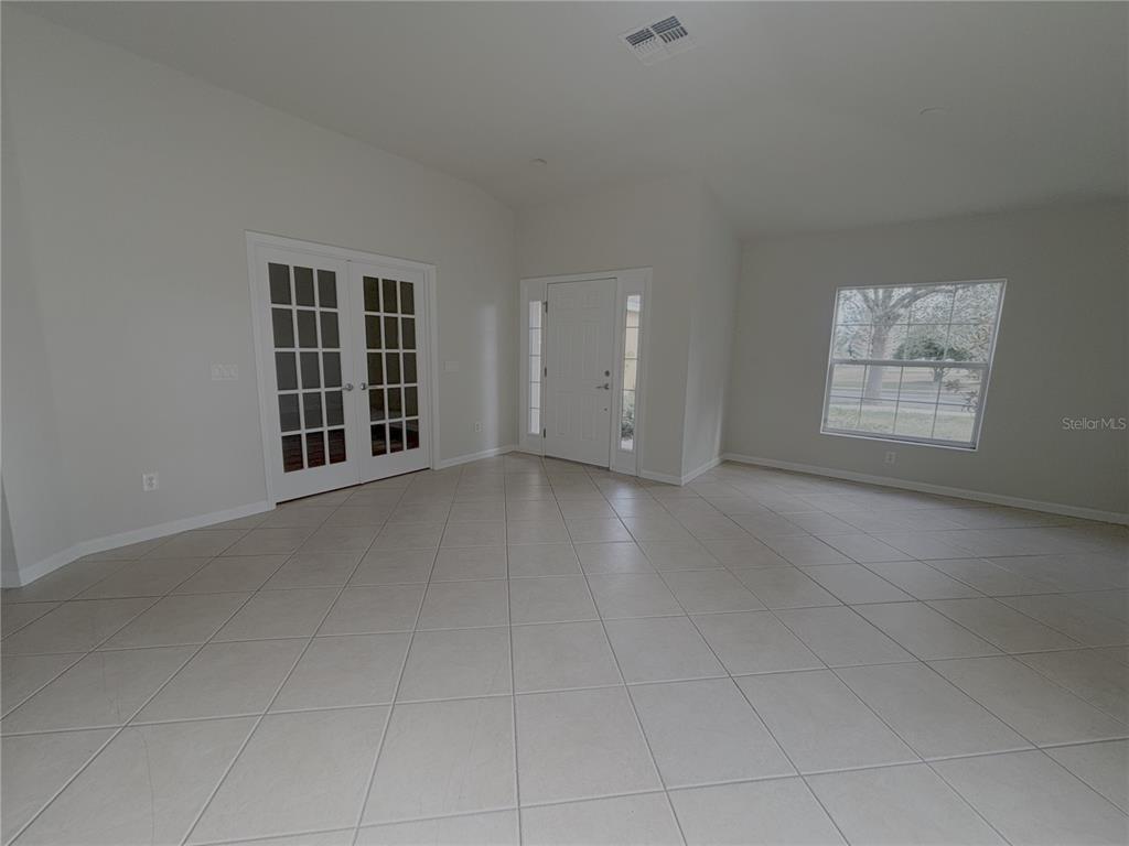 4194 Southwest 47th Court Ocala, FL 34474 - Photo 5 of 29 an empty room with windows