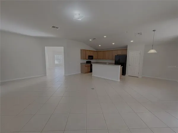 a view of a kitchen with a sink and microwave
