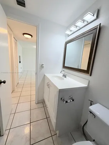 a view of an empty room and a window