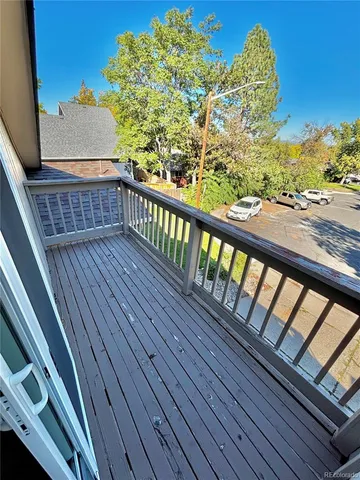 a view of balcony with wooden floor