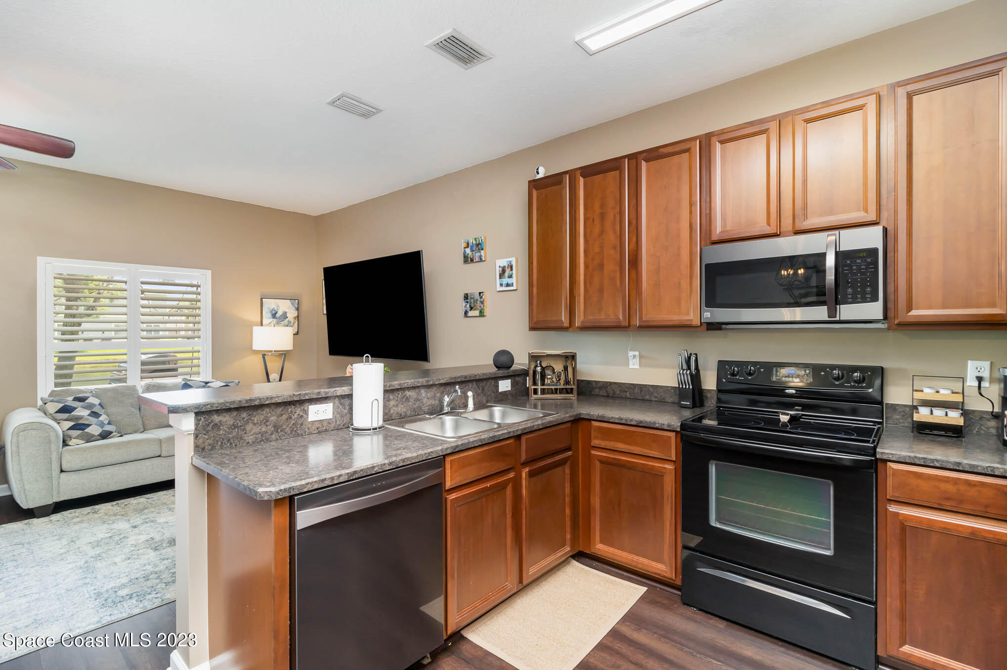 2805 Reston Street, Unit 103 Melbourne, FL 32935 - Photo 11 of 36 a kitchen with a sink stove and microwave