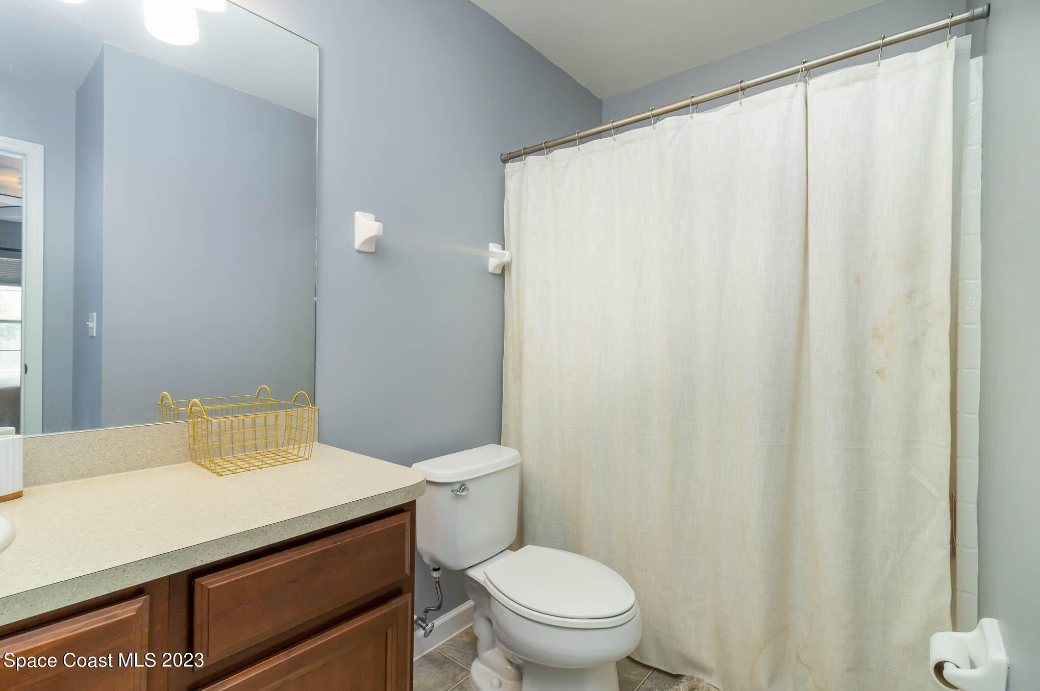 2805 Reston Street, Unit 103 Melbourne, FL 32935 - Photo 19 of 36 a bathroom with a sink and a toilet