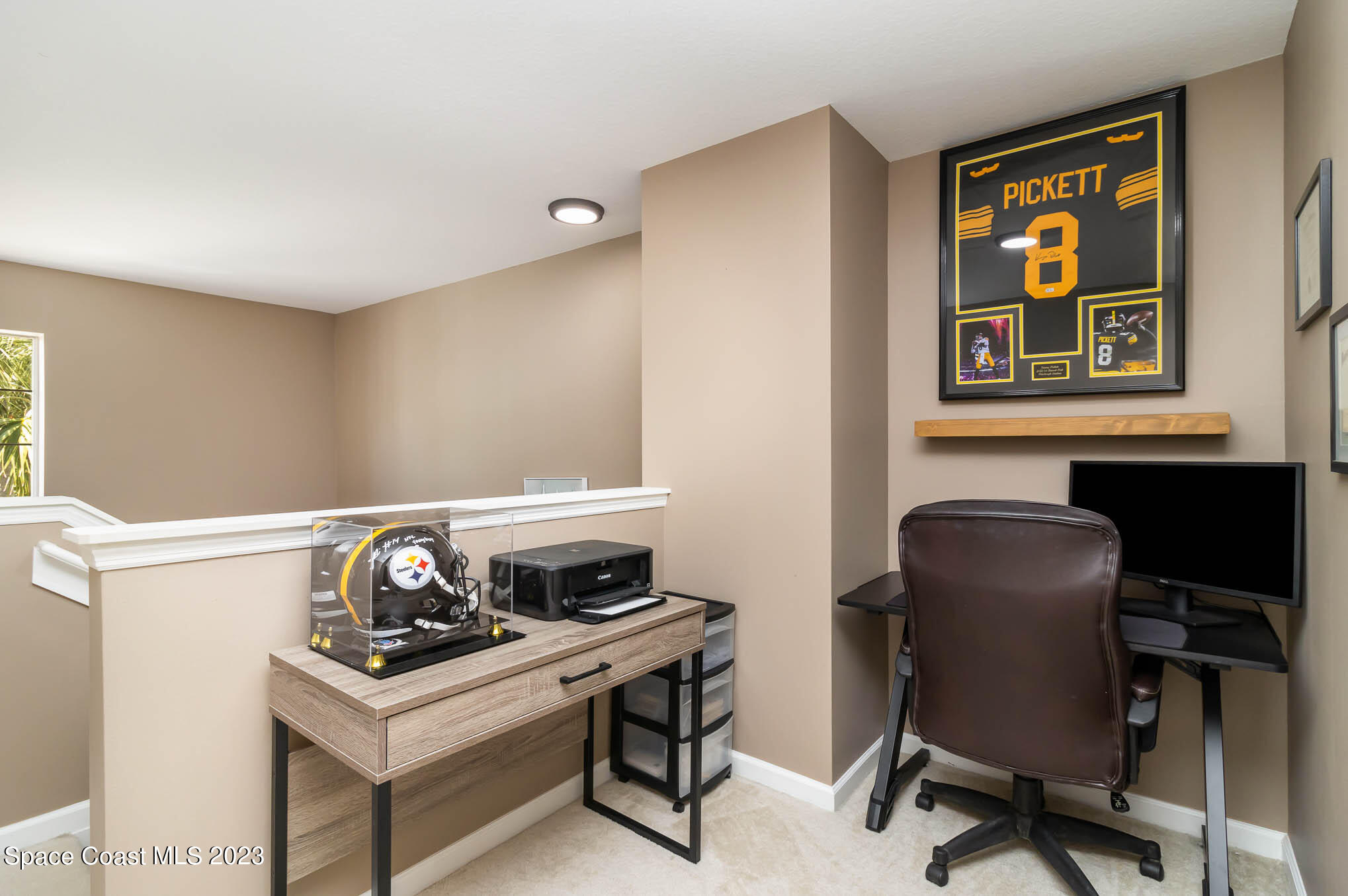 2805 Reston Street, Unit 103 Melbourne, FL 32935 - Photo 20 of 36 a work room with a stove and a chair