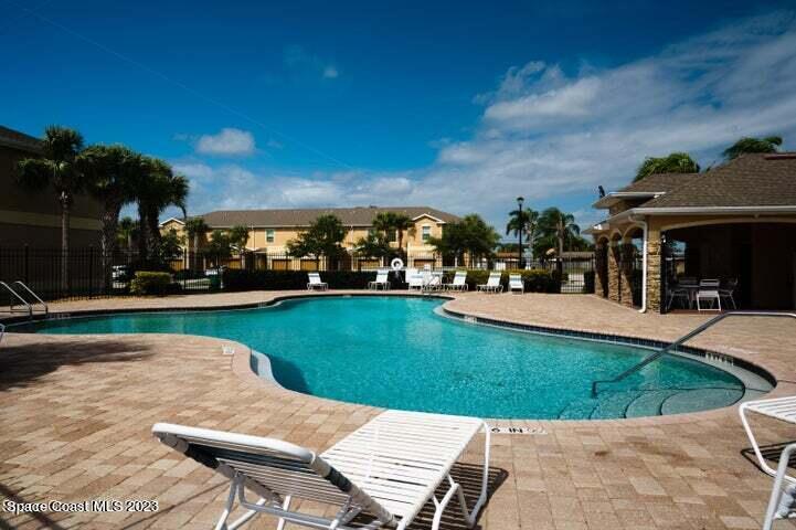 2805 Reston Street, Unit 103 Melbourne, FL 32935 - Photo 30 of 36 a view of a house with a swimming pool