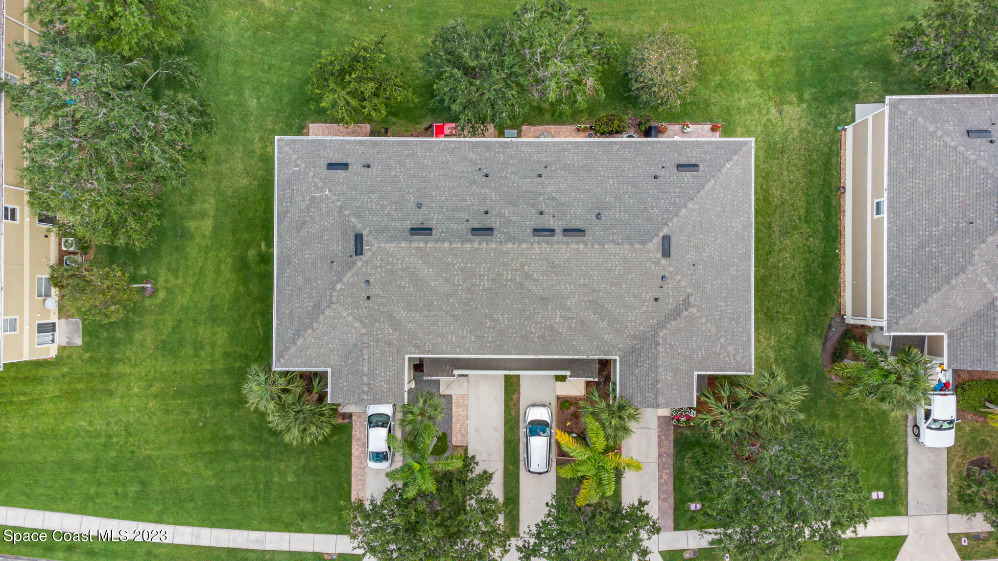 2805 Reston Street, Unit 103 Melbourne, FL 32935 - Photo 32 of 36 an aerial view of a house with garden space and street view