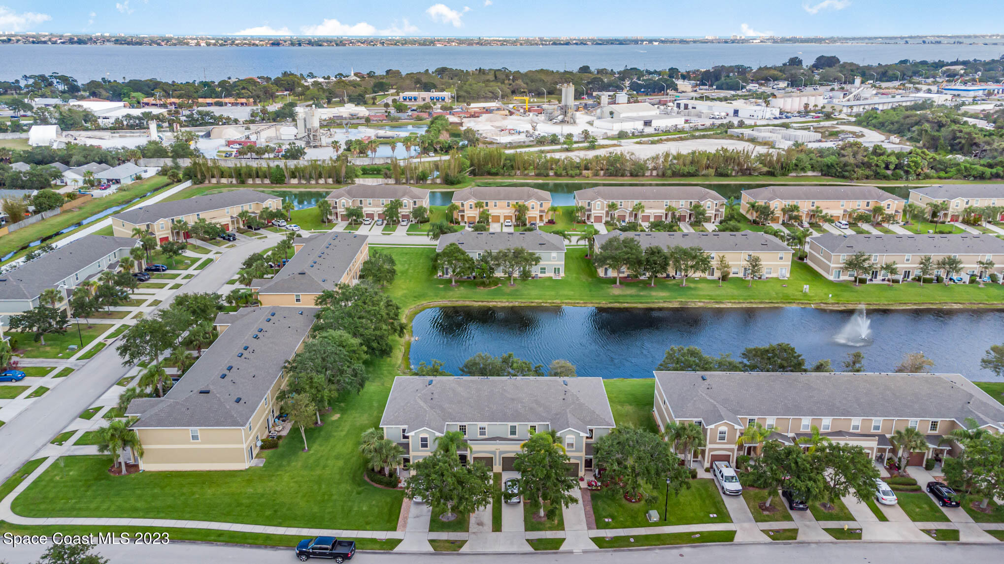 2805 Reston Street, Unit 103 Melbourne, FL 32935 - Photo 33 of 36 an aerial view of residential building with outdoor space and lake view