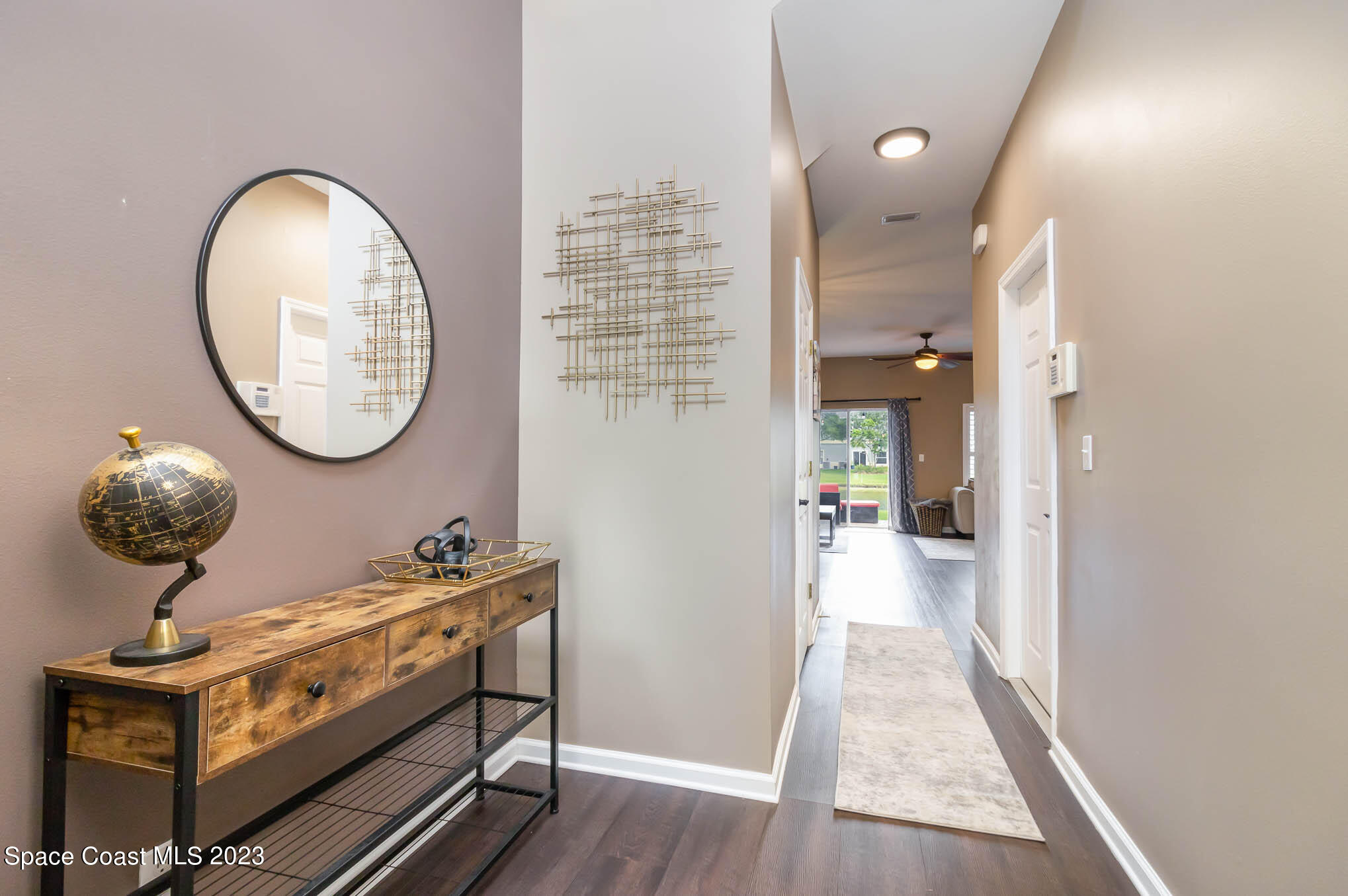 2805 Reston Street, Unit 103 Melbourne, FL 32935 - Photo 4 of 36 a view of a hallway with wooden floor and entryway