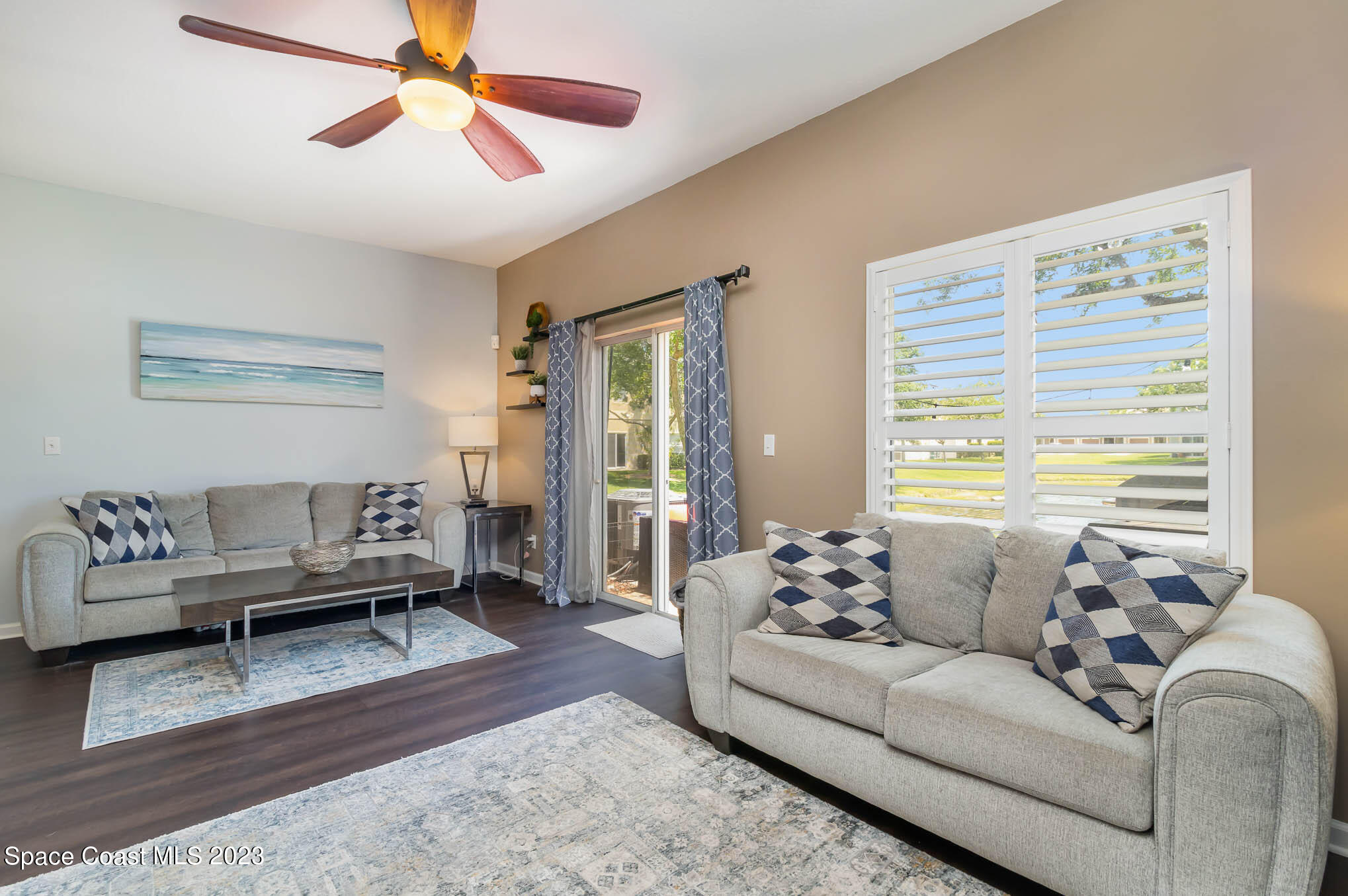2805 Reston Street, Unit 103 Melbourne, FL 32935 - Photo 9 of 36 a living room with furniture and a large window