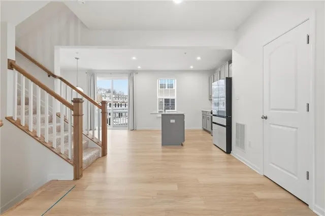a view of an entryway with wooden floor
