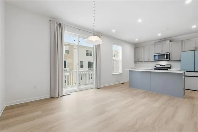 a view of room with wooden floor