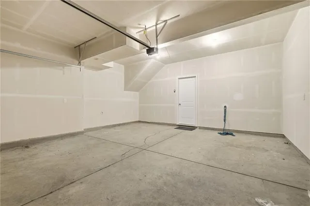 a view of a house with wooden fence