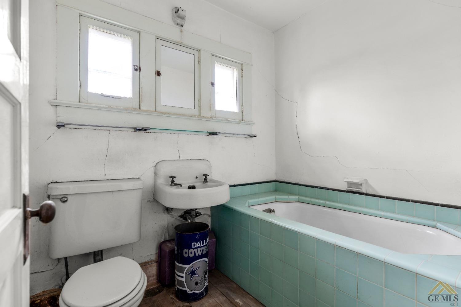 Undisclosed Address Tehachapi, CA 93561 - Photo 11 of 22 a bathroom with a sink a toilet and bathtub