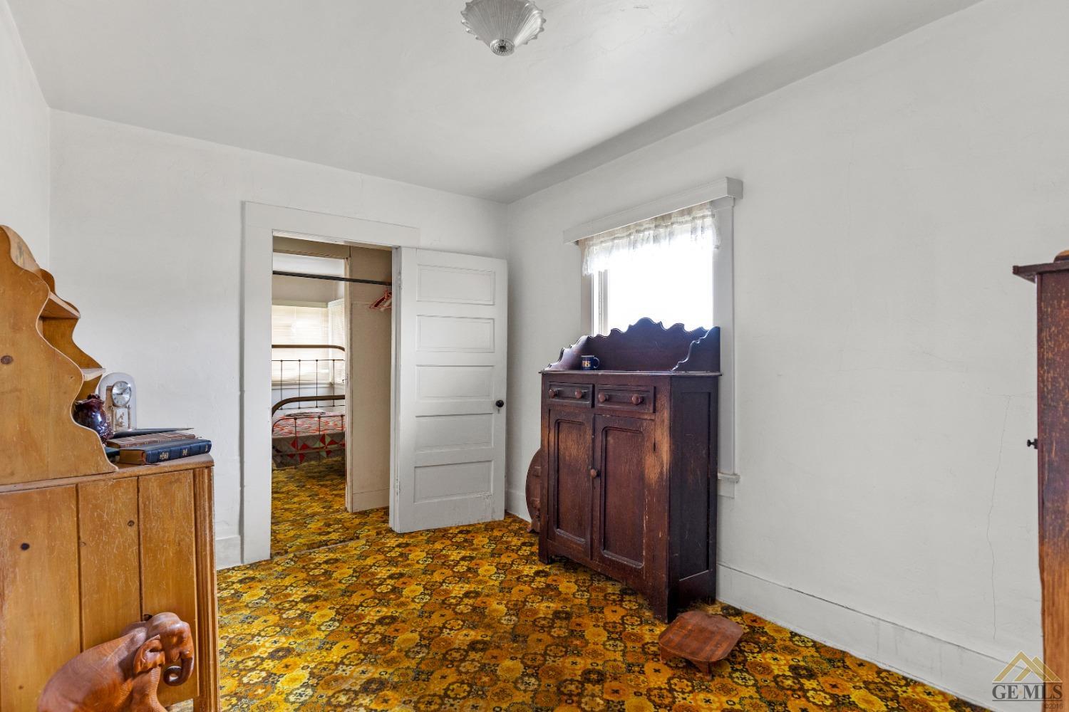 Undisclosed Address Tehachapi, CA 93561 - Photo 12 of 22 a bedroom with a bed and wooden floor