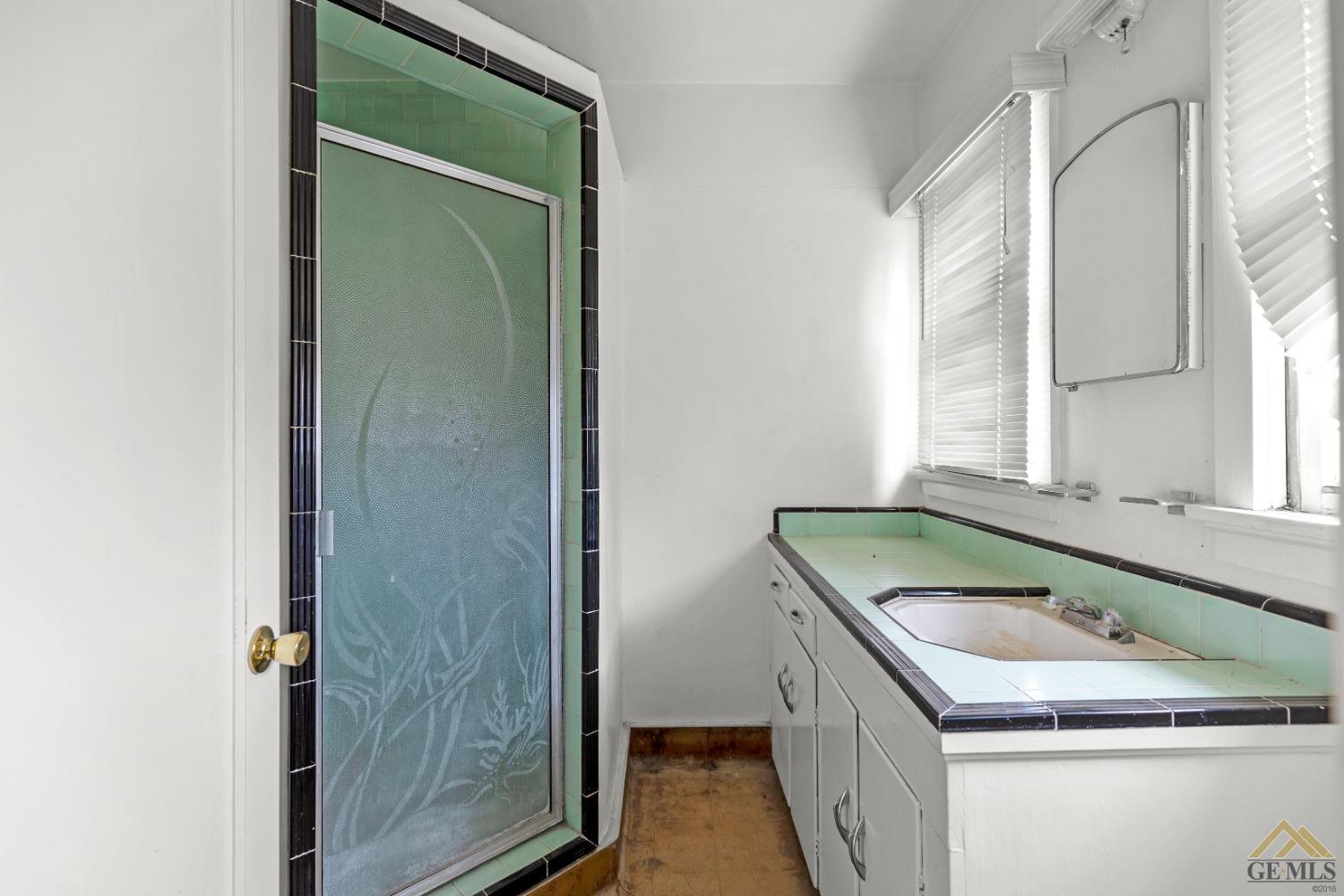 Undisclosed Address Tehachapi, CA 93561 - Photo 15 of 22 a bathroom with a granite countertop sink and a vanity