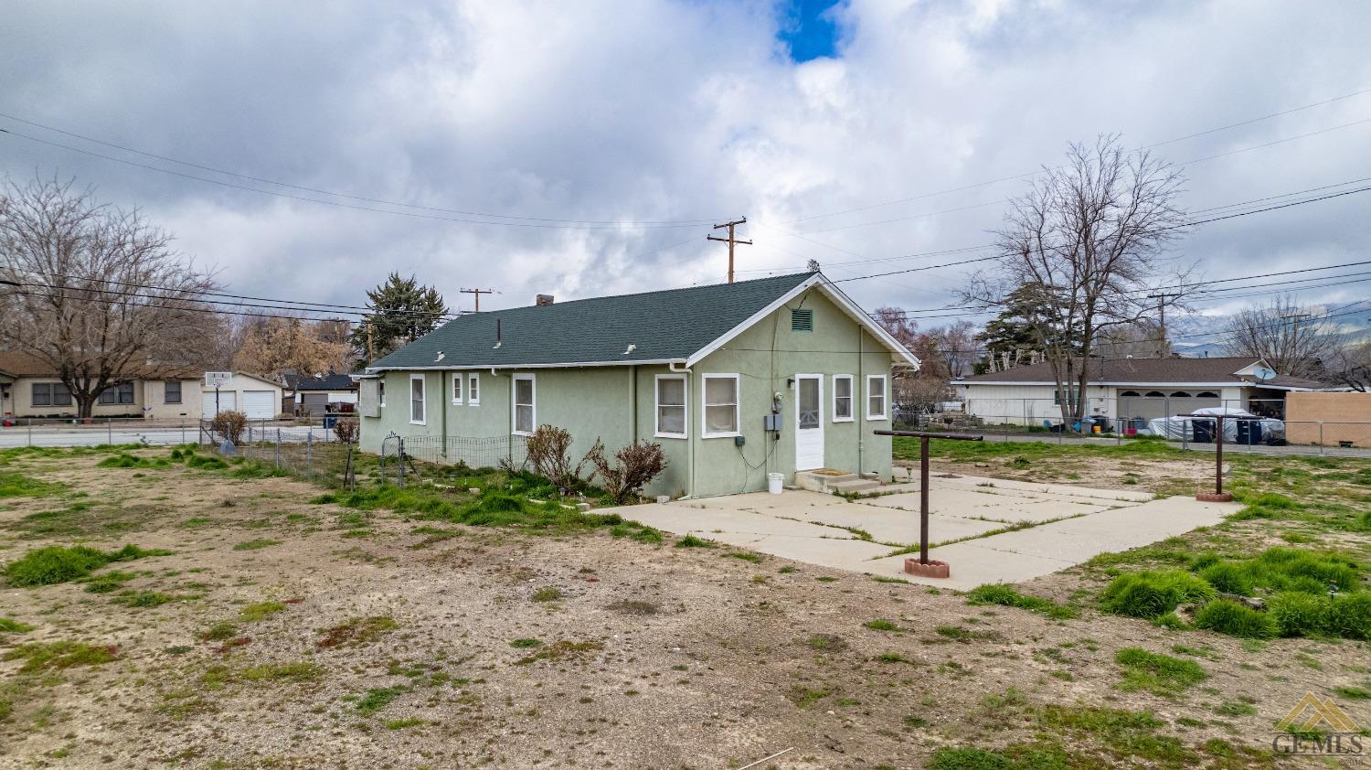 Undisclosed Address Tehachapi, CA 93561 - Photo 2 of 22 a front view of a house with garden