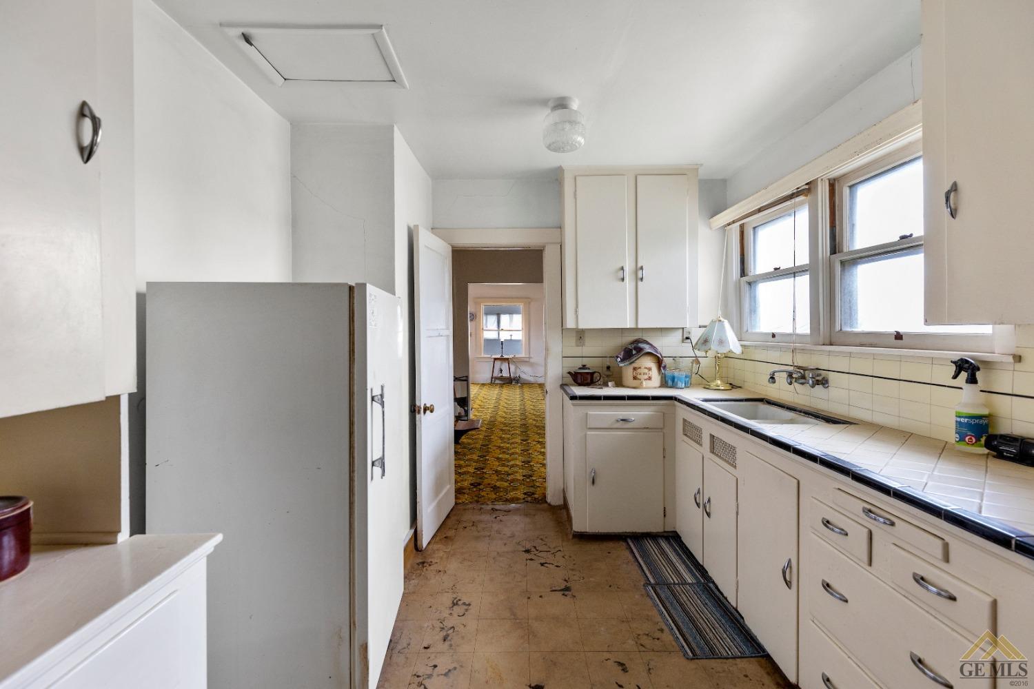 Undisclosed Address Tehachapi, CA 93561 - Photo 3 of 22 a kitchen with sink cabinets and window