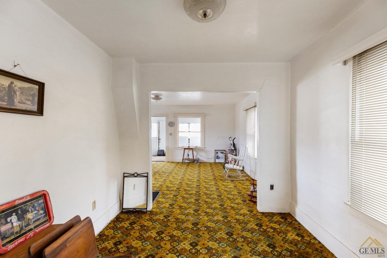 Undisclosed Address Tehachapi, CA 93561 - Photo 5 of 22 a large room with mirror next to a window