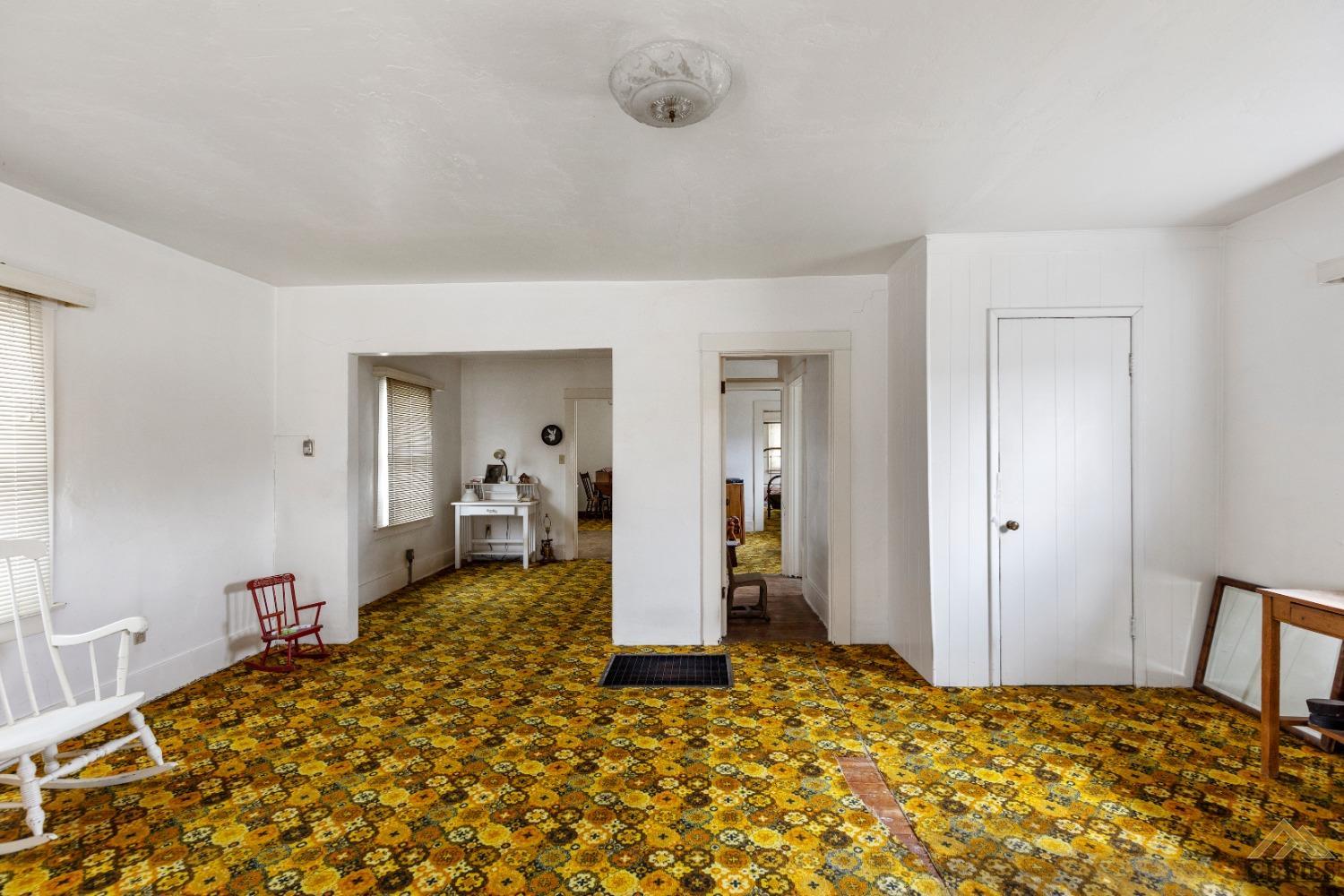 Undisclosed Address Tehachapi, CA 93561 - Photo 8 of 22 a bedroom with a bed and cabinets