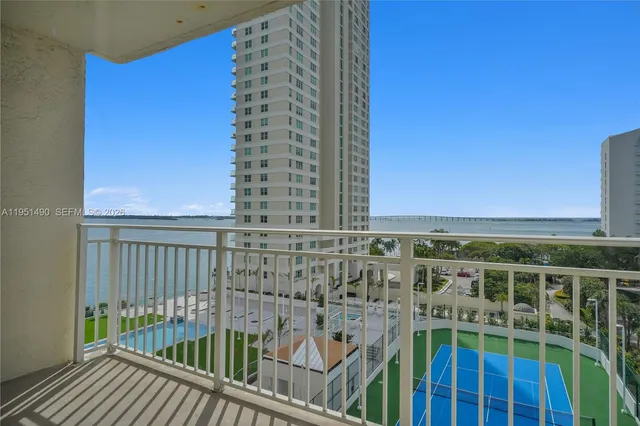 a view of balcony with wooden floor
