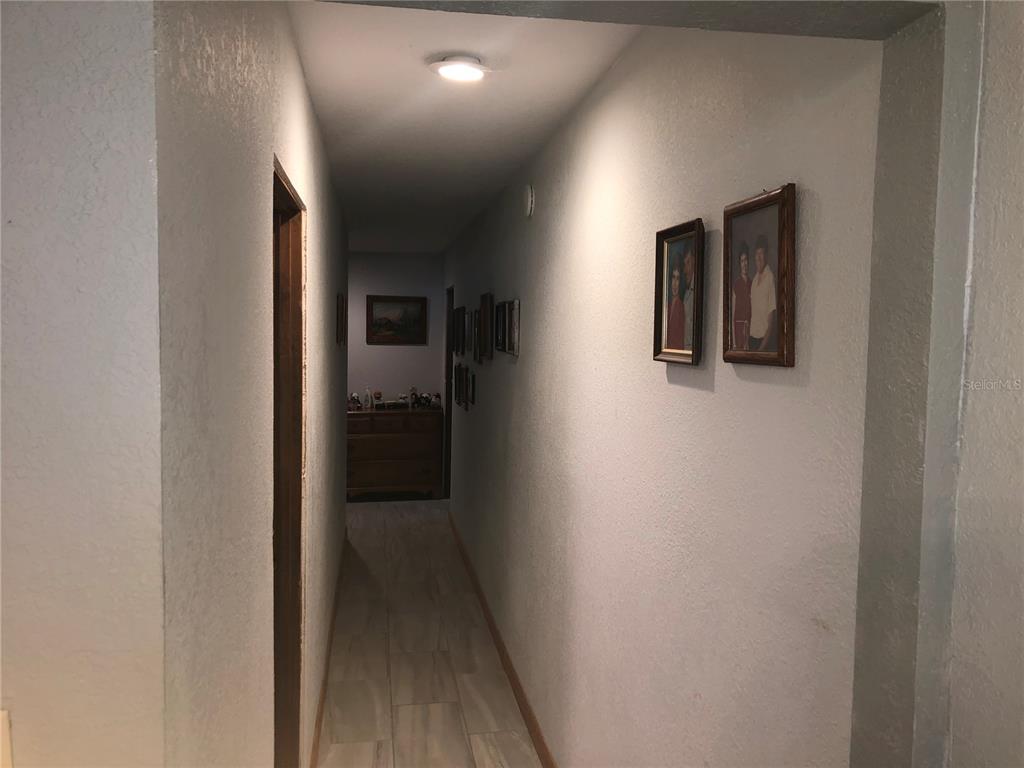 136 Commercial Street Coleman, FL 32163 - Photo 11 of 14 a view of a hallway