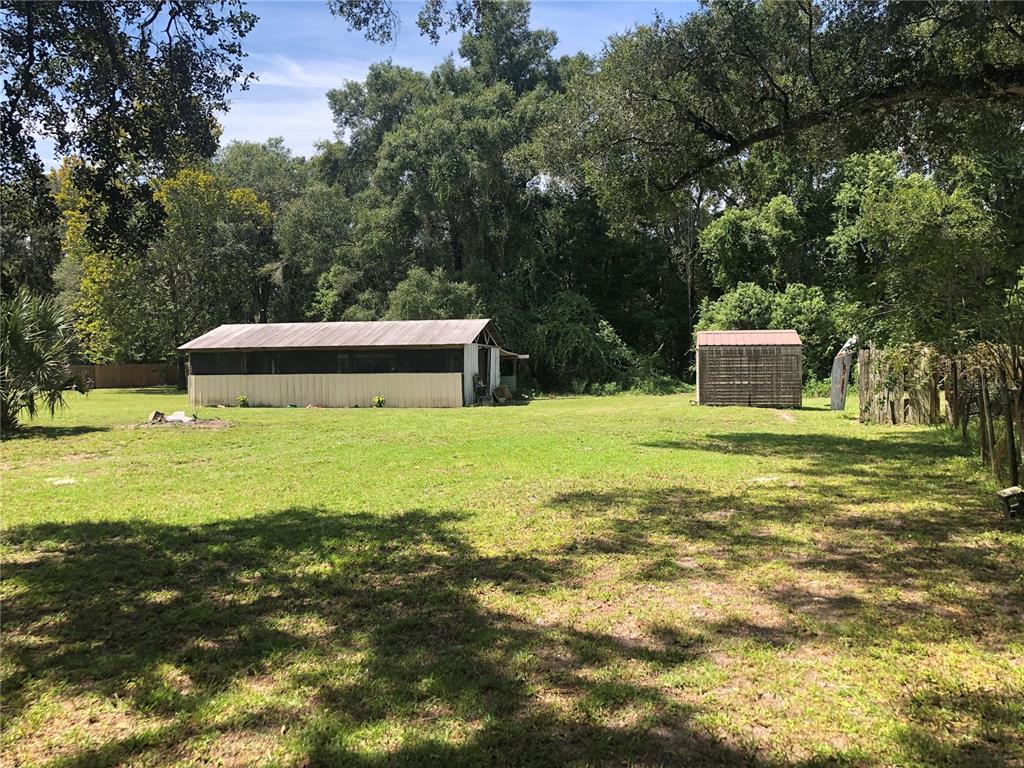 136 Commercial Street Coleman, FL 32163 - Photo 4 of 14 a view of a house with a yard