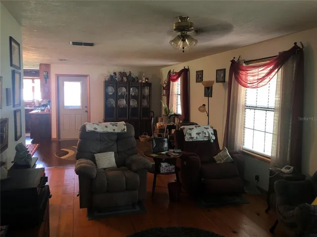 a living room with furniture and a window