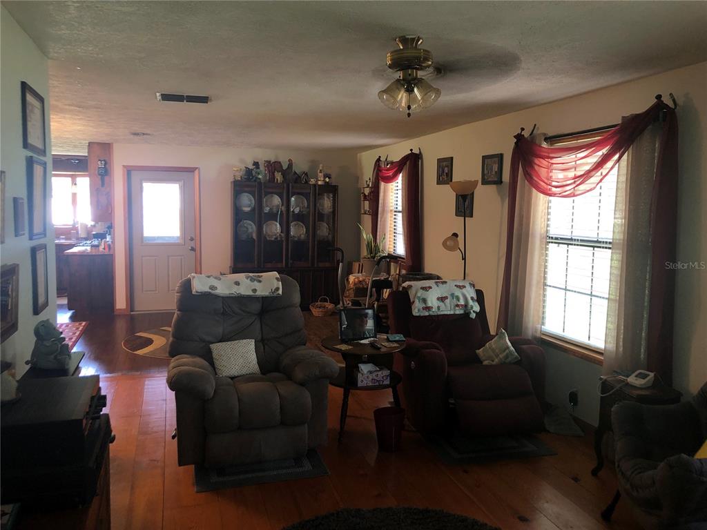 136 Commercial Street Coleman, FL 32163 - Photo 6 of 14 a living room with furniture and a window