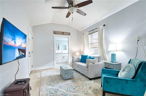 a living room with furniture and a window