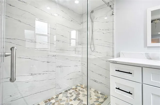 a bathroom with a bathtub and a shower