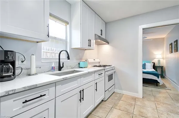 a kitchen with a sink and cabinets
