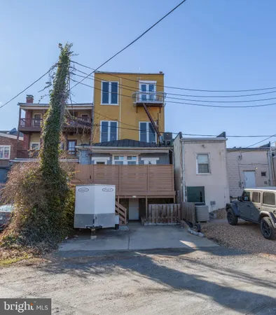 a view of a car park in front of house