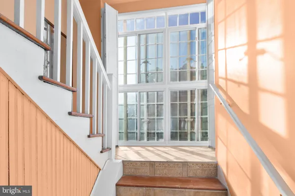 a view of staircase with large window