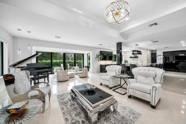a large kitchen with stainless steel appliances granite countertop a sink and a stove