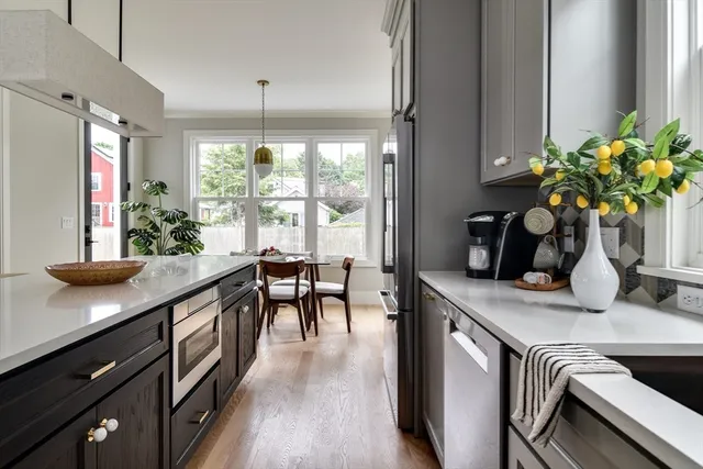 a kitchen with a table and chairs